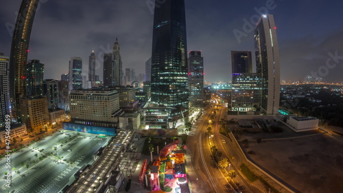 Panorama of Dubai International Financial district aerial night to day timelapse. View of business office towers.