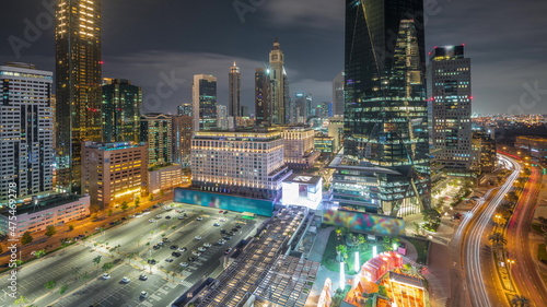 Dubai International Financial district aerial all night timelapse. Panoramic view of business and financial office towers.