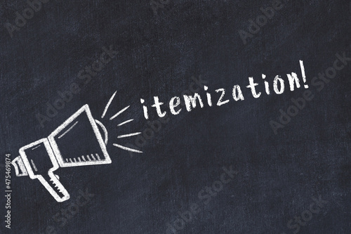Chalk loudspeaker and inscription itemization on black chalkboard