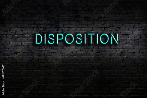 Neon sign. Word disposition against brick wall. Night view photo