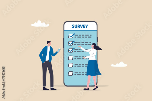 Online survey questionnaire, poll, opinion or customer feedback using internet concept, man and woman using mobile or smartphone to fill in online survey checklist. photo