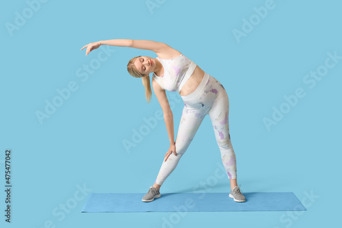 Young pregnant woman exerci...
