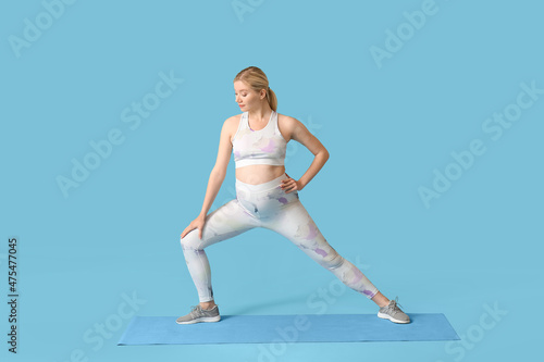 Young pregnant woman exerci...