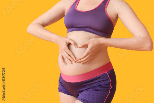 Sporty young pregnant woman...