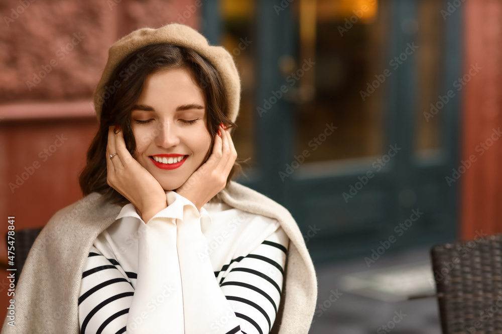 Happy woman with closed eyes wearing plaid outdoors Happy woman with closed eyes wearing plaid outdoors