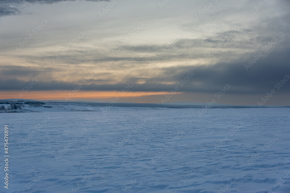 Snowy steppe at sunrise (sunset).