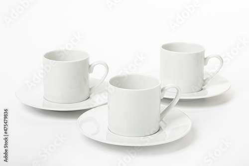 White porcelain cup and saucer for cappuccino and coffee isolated on a white background