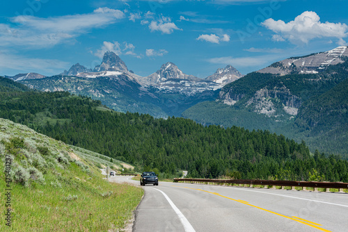 USA  Wyoming. Car on Ski Hill Road with view of Grand Teton  west side of Teton Mountains