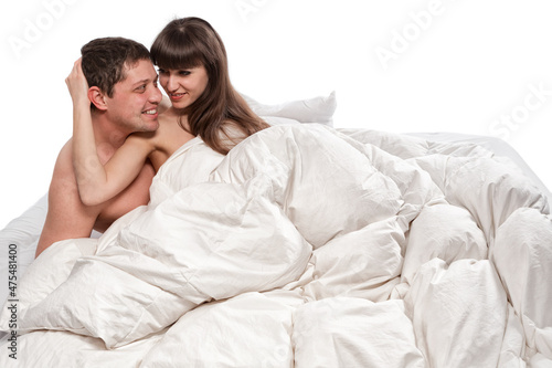 Couple of beauty lovers in bed on white background