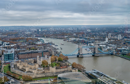 Aerial view of Tower  and Tower Bridge in London. © borisbelenky