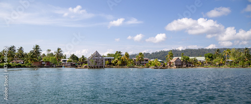 Waterfront houses in a village in Marovo Lagoon of the Solomon Islands. photo