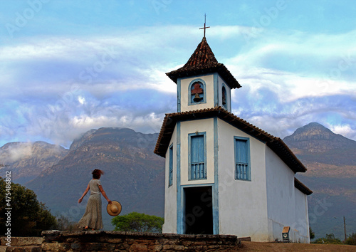 Mulher em frente à Capela de Santa quitéria, Catas Altas, Minas gerais  photo