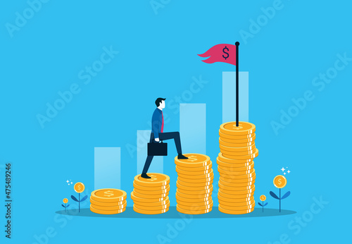 Financial increase goal, wealth management and investment plan to achieve target. Businessman step climbing money coin stack aiming to achieve target flag on top.