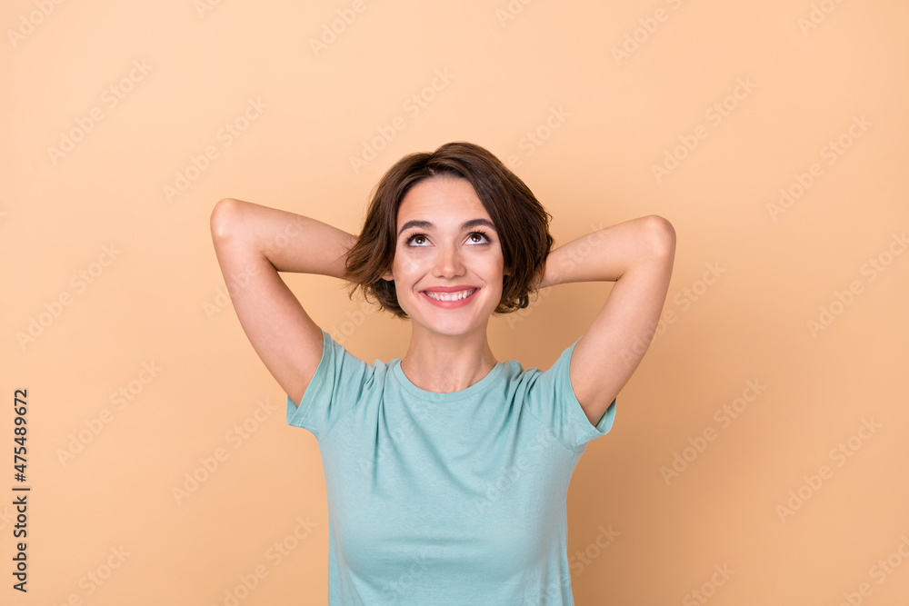 Top above high angle view photo of young pretty girl curious look empty space imagination isolated over beige color background Top above high angle view photo of young pretty girl curious look empty space imagination isolated over beige color background