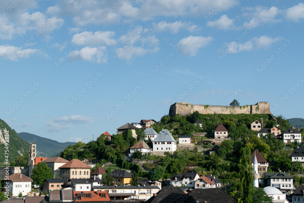 Medieval fortress on a hill surrounded by traditional houses in Jajce, Bosnia and Herzegovina