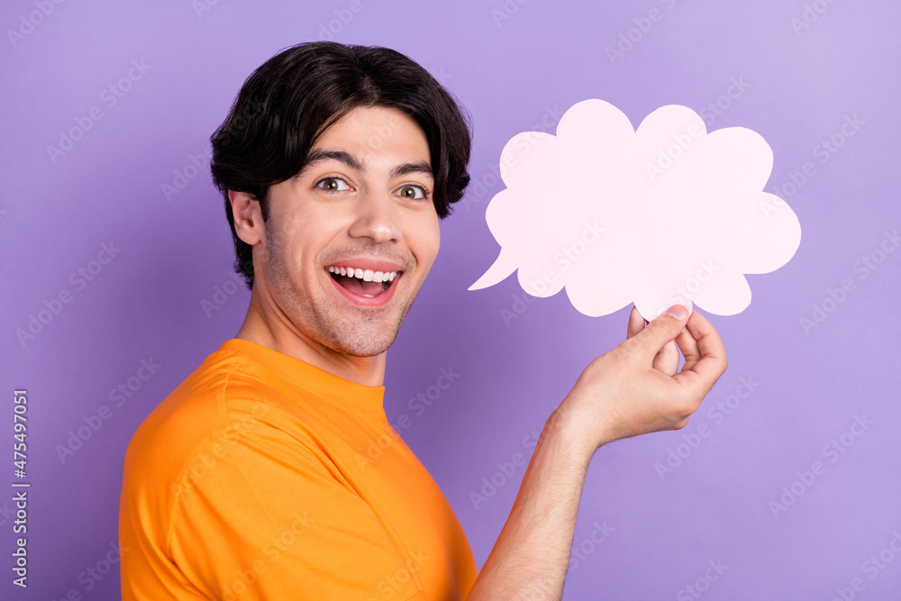 Profile side photo of charming cheerful happy man hold cloud speech say isolated on purple color background Profile side photo of charming cheerful happy man hold cloud speech say isolated on purple color background