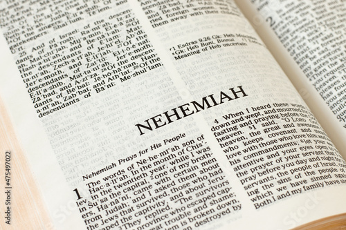 Nehemiah Bible open Book Holy Christian Scripture Old Testament. Biblical concept. Pages of the Word of God and Jesus Christ written in English. A close-up.