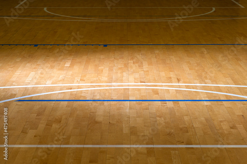 Wooden floor basketball, badminton, futsal, handball, volleyball, football, soccer court with natural lighting. 