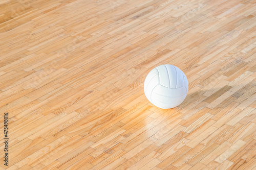 Volleyball ball and white line on wooden court. Horizontal education and sport poster, greeting cards, headers, website