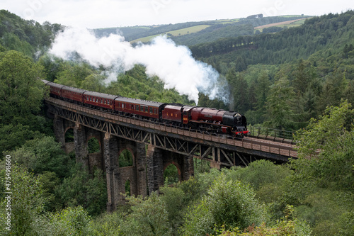 6233 Duchess of Sutherland steam train in the forest at Largin in Cornwall UK