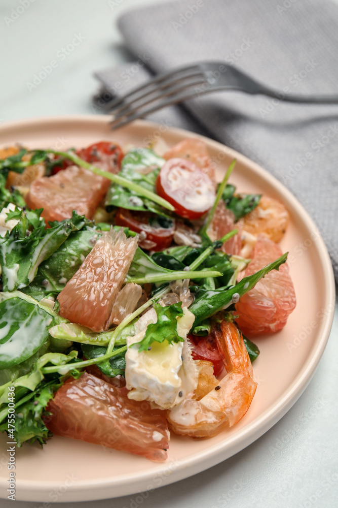Delicious pomelo salad with shrimps served on white table, closeup Delicious pomelo salad with shrimps served on white table, closeup