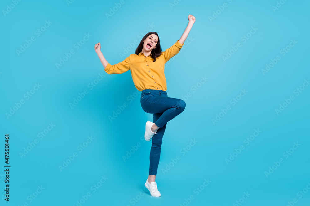 Full size photo of cool brunette hairdo young lady yell wear shirt trousers shoes isolated on blue background Full size photo of cool brunette hairdo young lady yell wear shirt trousers shoes isolated on blue background