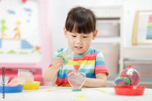 young girl making sand crafts for homeschooling