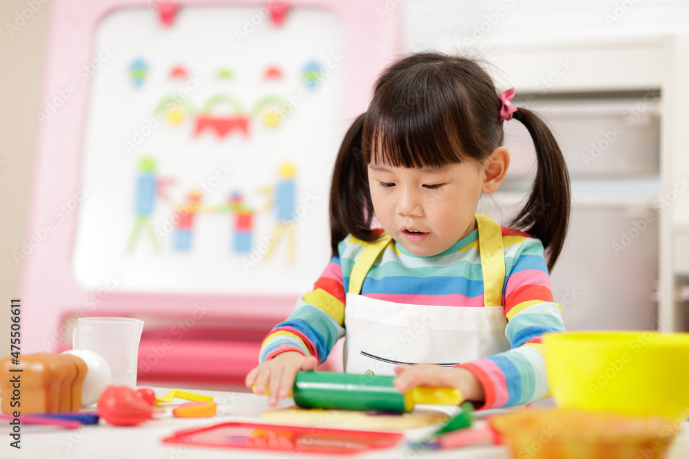 young girl pretend playing food preparing at home young girl pretend playing food preparing at home