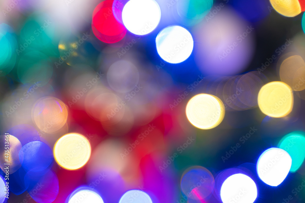 Christmas background. Photo of blurred Christmas lights at night. Defocused Christmas background. Photo of blurred Christmas lights at night. Defocused