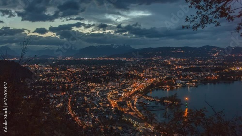 An aerial shot of a city of a Bregenz under the cloudy skies in the evening