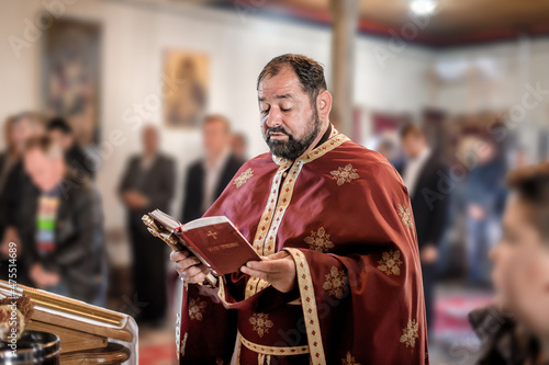 Fototapeta Religious priest during church service