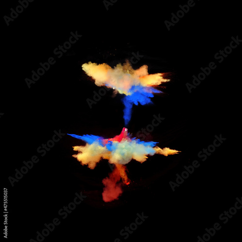 Bizarre forms of powder paint explode in front of a black background to give off fantastic multi colors and forms.