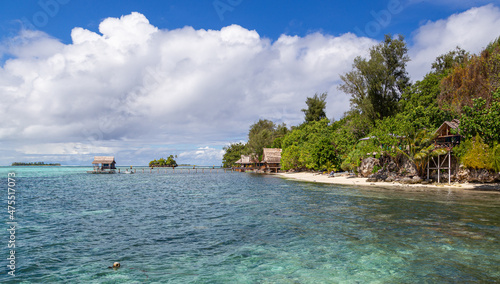 Idyllic tropical resort on calm lagoon waters near Gizo in the Solomon Islands. photo