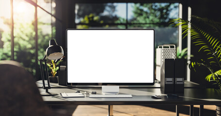 Computer all-in-one with a blank screen front in industrial loft green ecological office interior