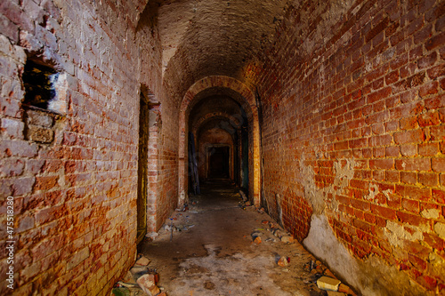 Vaulted red brick dungeon under old castle © Mulderphoto