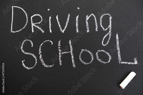 Driving school chalkboard, Educational and Creative composition with the Driving school caption. toy car model.