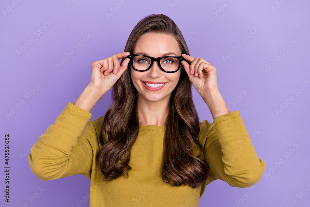 Photo of positive pretty person hands touch glasses look camera isolated on purple color background Photo of positive pretty person hands touch glasses look camera isolated on purple color background