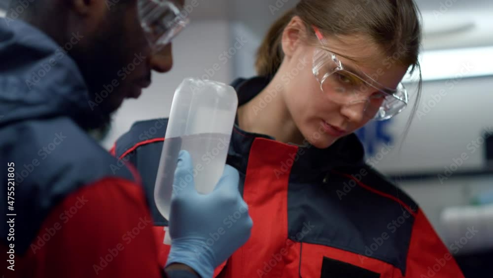 Mixed race health care professionals preparing for medical help procedure Mixed race health care professionals preparing for medical help procedure