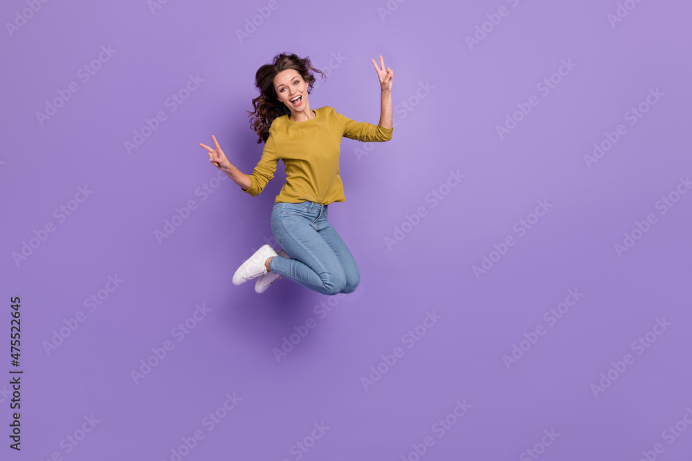 Full size photo of active cheerful person rejoice two arms show v-sign isolated on purple color background