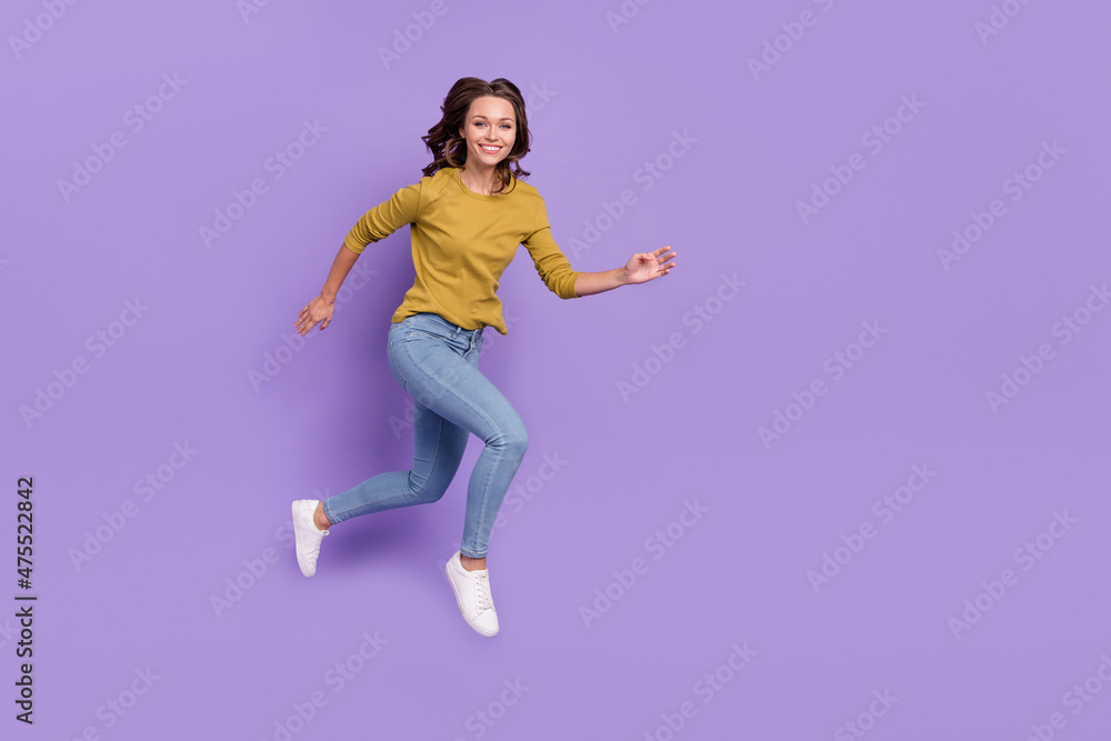 Full length profile portrait of excited active person running toothy smile isolated on violet color background