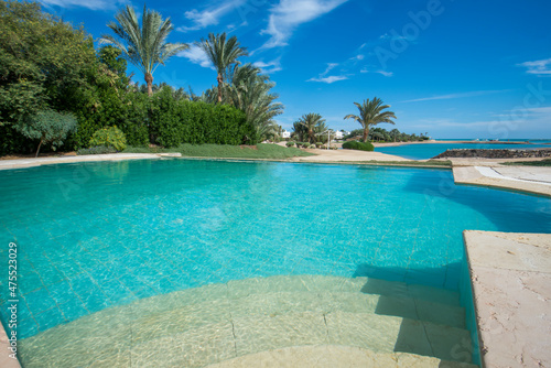 Fototapeta Naklejka Na Ścianę i Meble -  Swimming pool at at luxury tropical holiday villa