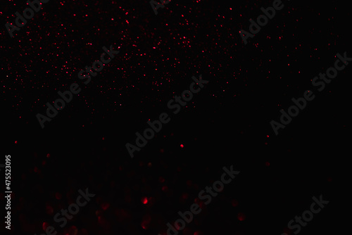 abstract redon black bokeh background overlay layer. sparks and blowing. festive background. Sparkling magical dust particles.