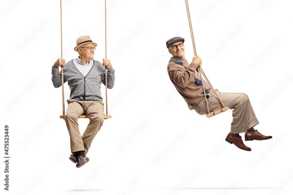 Full length shot of cheerful elderly men on wooden swings Full length shot of cheerful elderly men on wooden swings