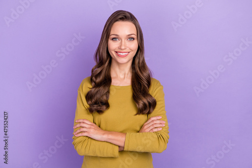 Portrait of candid friendly lady folded arms toothy smile look camera isolated on purple color background