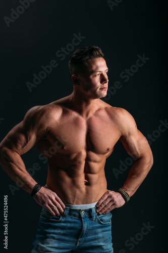 young man, brutal appearance, with a beautiful torso, bodybuilder, in the studio © Дмитрий Бесов