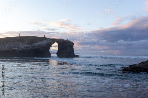 Natural rock arch in beach of Cathedrals, in Lugo, Galicia, Spain. © gamusinos