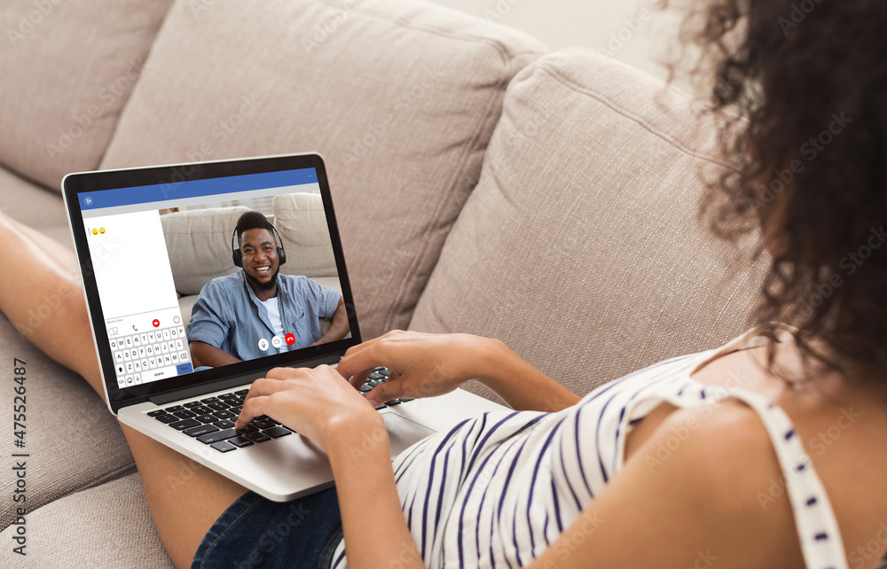 Naklejka premium Video Chat. Young Black Woman Having Online Date With Her Boyfriend