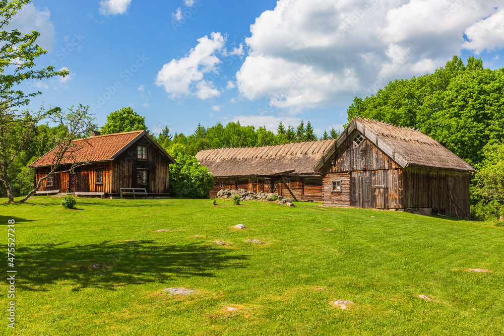 Old idyllic farm with wooden houses in a beautiful landscape Old idyllic farm with wooden houses in a beautiful landscape