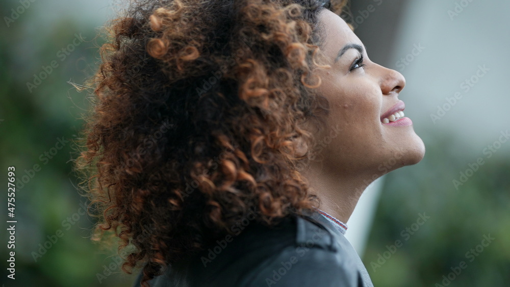 Woman closing eyes to sky feeling freedom. Carefree person having HOPE Woman closing eyes to sky feeling freedom. Carefree person having HOPE