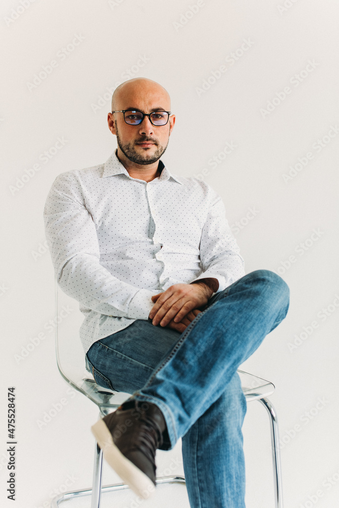 a young man, business, sociable speaker, businessman, says something with gestures. in the studio on a white background.